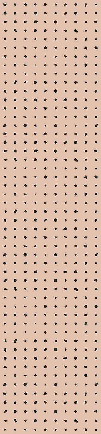 A roll of dotted line wallpaper with a beige background and black dots pattern from drop it MODERN.
