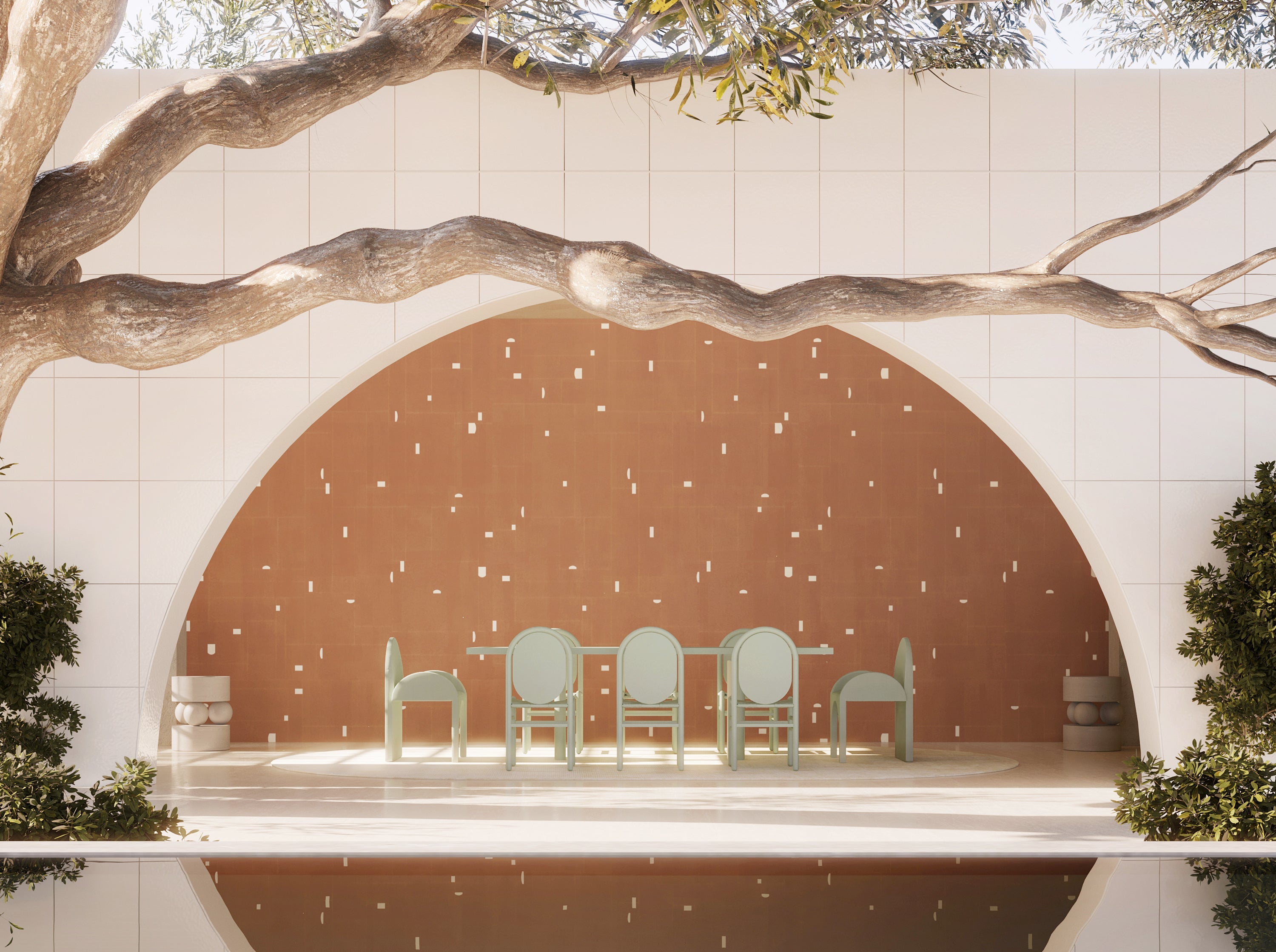 Dining area with chairs and a table framed by tree branches and a circular wall from drop it MODERN.