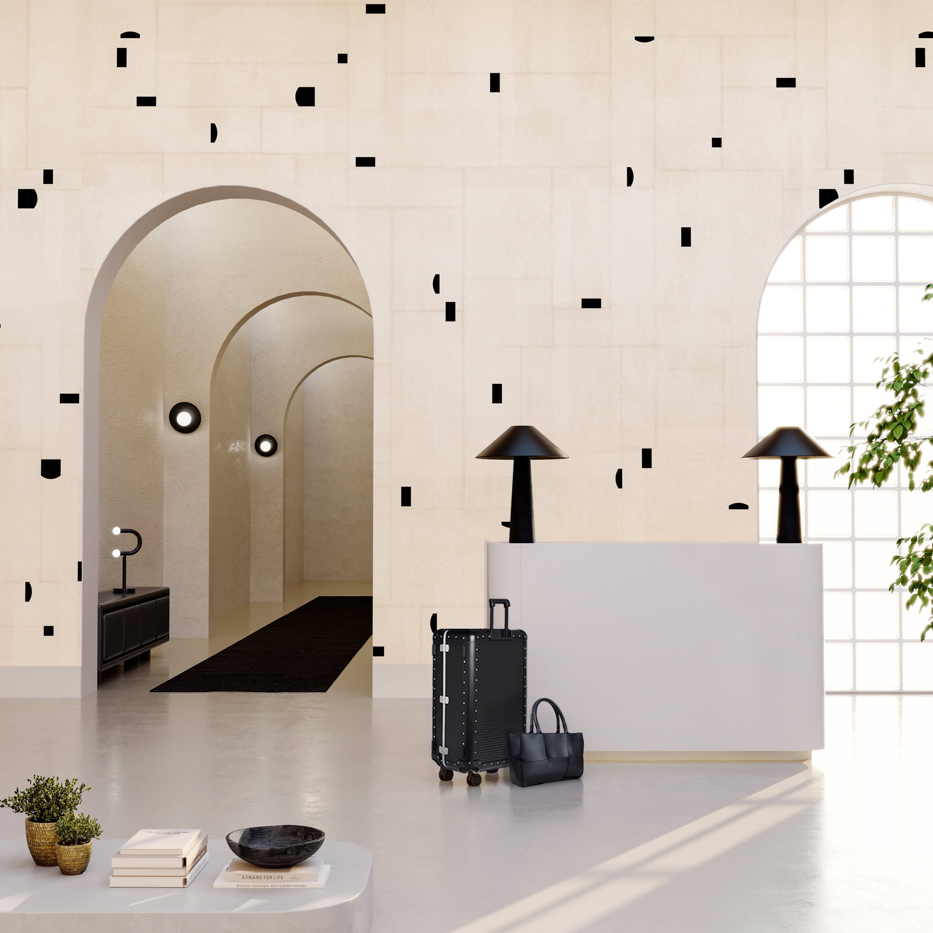 The Geometrico© Wallpaper in Cremé + Black in a hotel lobby from drop it MODERN.